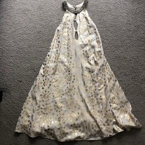 Beautiful Gold Star dress with intricate neck